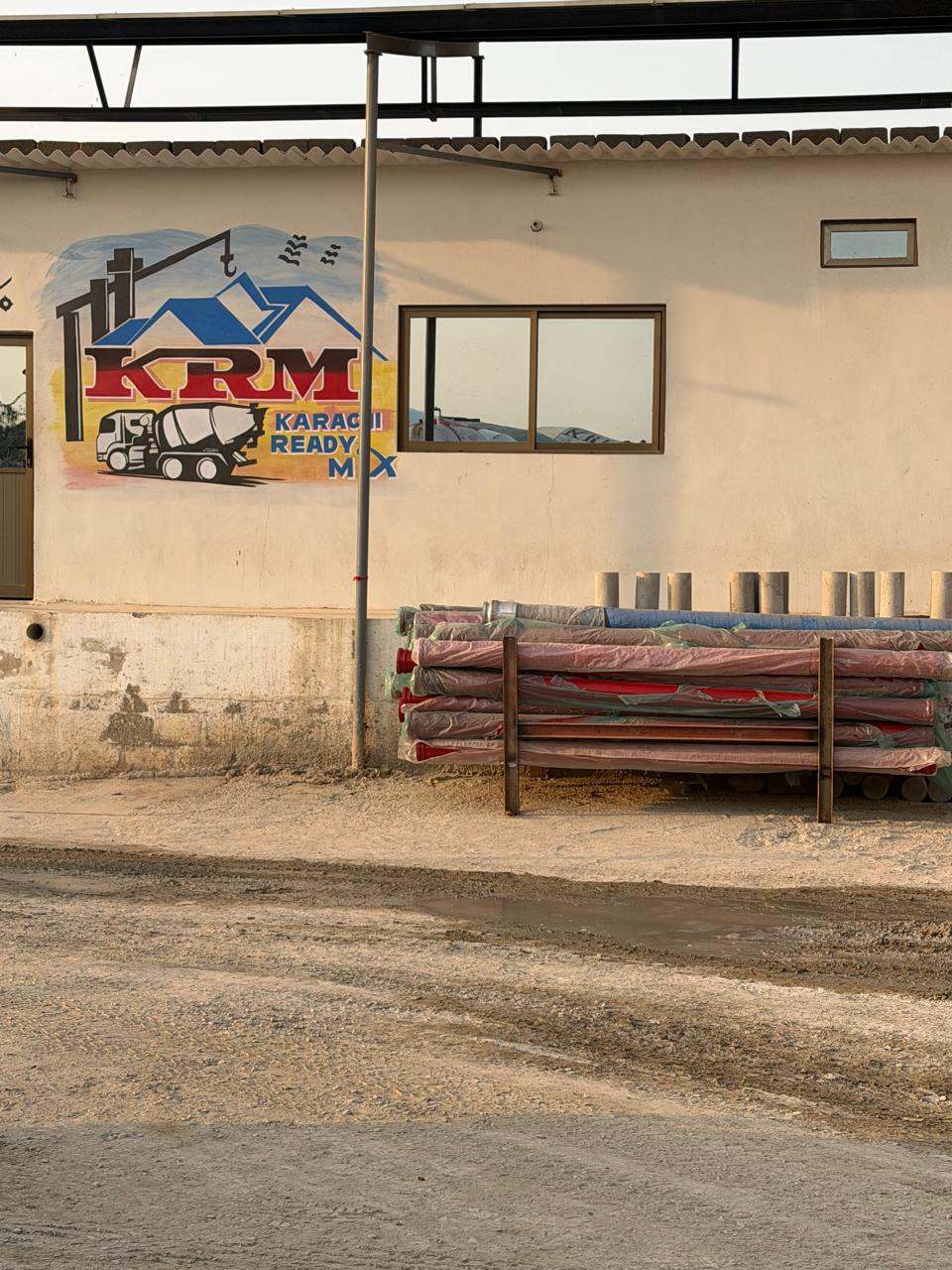 Karachi Ready Mix facility exterior with KRM wall mark